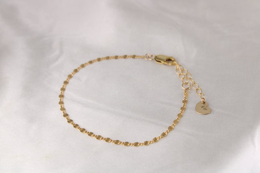 Gold disc-chain bracelet with lobster clasp and TF heart tag