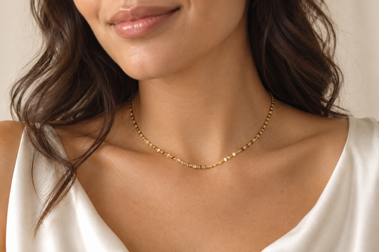 Digitally created lifestyle styling mockup of the Celeste gold-filled sequin chain necklace