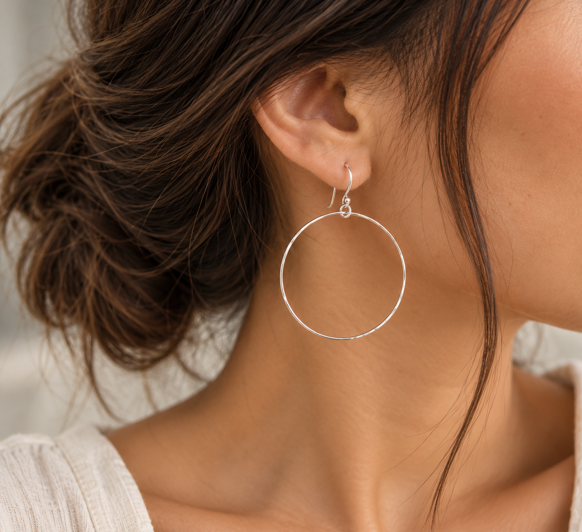 Sterling silver Classic Hammered Circle Drop Earrings worn on model