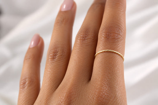 Lainey fine gold-filled sparkle ring on a lifelike model hand