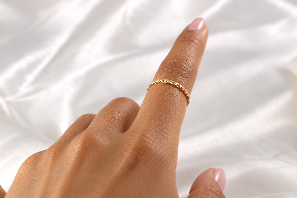 Lena and Lainey gold-filled sparkle rings stacked on a model hand