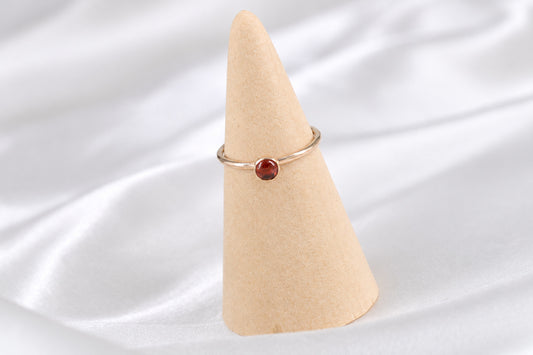 Rowena gold-filled bezel ring with a garnet cabochon